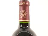 a bottle of wine that is sitting on a table