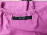 a close up of a pink pants with a black label on it