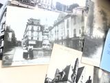 de nombreuses vieilles photos de personnes et de bâtiments accrochées au mur