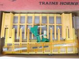 a toy train set in a box on a table