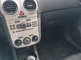 the interior of a car with a steering control and dashboard controls