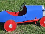 a toy car that is sitting in the grass