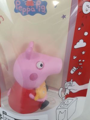 pep the pig in a red shirt with a yellow star on it ' s chest