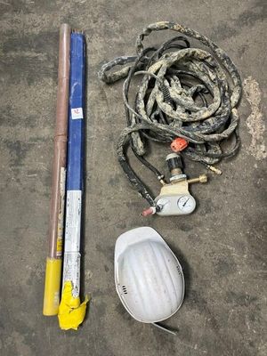 a fire hydrant, a hose, and a hose on the ground