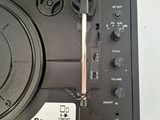 a close up of a turntable with a bluetooth on it