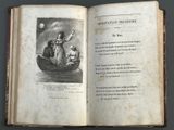 a book with a picture of a man in a boat