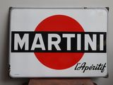 a white sign with a red circle on top of it
