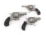 three old revolvers on a white background with a white background