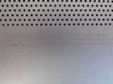 a close up of a metal plate with holes on it