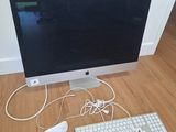a computer monitor, keyboard, mouse and mouse on the floor