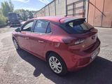 a picture of a red car parked in a parking lot