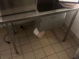 an image of a kitchen with a sink and a counter