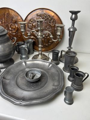 a lot of silver items sitting on a table