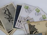 a pile of old postcards sitting on top of a table
