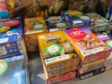 many boxes of food sitting on a table in a store