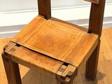 a small wooden chair sitting on a hard wood floor