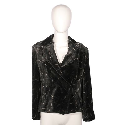the mannequin is wearing a black jacket and white pants