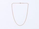a gold chain necklace with a diamond clasp on a white background