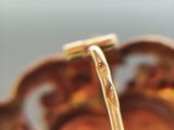 a close up of a spoon with a handle on it