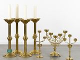 a lot of candles that are sitting on the floor