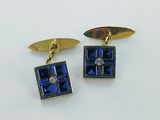 two pairs of blue and gold cufflinks with diamonds on them