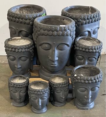 a lot of pots that are sitting on a table