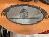 a table with a mirror and a pair of shoes on it