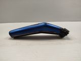 a blue hair clipper sitting on a table