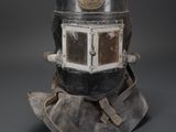 a close up of a helmet on a gray surface with a gray background