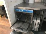 an open oven that is sitting in a kitchen