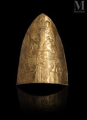 a close up of a gold ring on a black surface