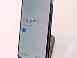 an image of a cell phone is sitting on top of a stand
