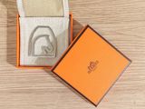 an orange box with a watch inside of it on a table