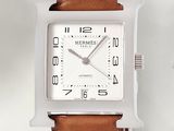 an image of a close up of a watch on a white surface