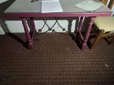 a small table with a chair and a book on it