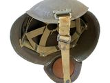 helmet is made of cloth and has a metal buckle on the side