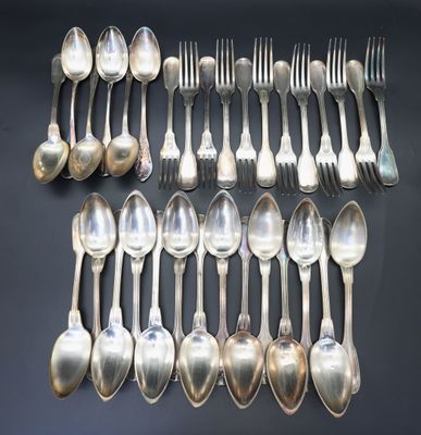 twelve silverplated spoons and forks arranged on a black surface