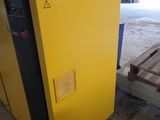 an industrial air dryer in a warehouse with a yellow panel