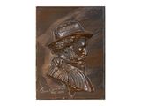 une plaque en bronze représentant un homme portant un chapeau et une barbe
