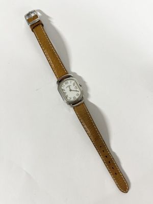 HERMÈS PARIS : MONTRE DE DAME en acier, modèle « Rallye », b…