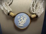 an image of a necklace with a picture of a woman on it