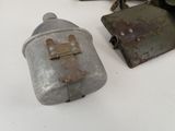 two old metal items that are on a table