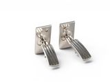 pair of silver plated cufflinks on a white background