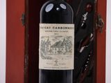 a bottle of wine that is sitting in a wooden case