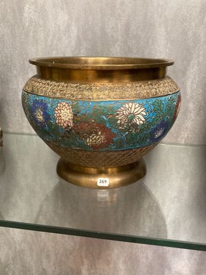 three vases sitting on a glass shelf next to each other