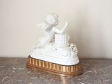 a statue of an angel on top of a table