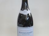 a bottle of wine that is sitting on a table