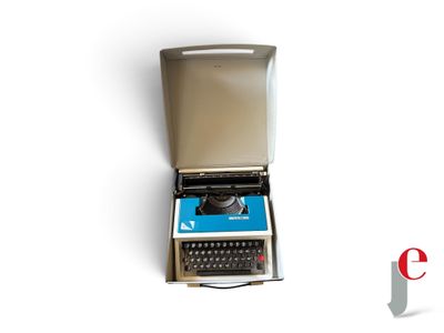 an old typewriter sitting in a box on a white surface