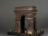 an antique bronze model of the arc of triumph on a marble base