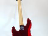 an electric guitar on a stand against a white background